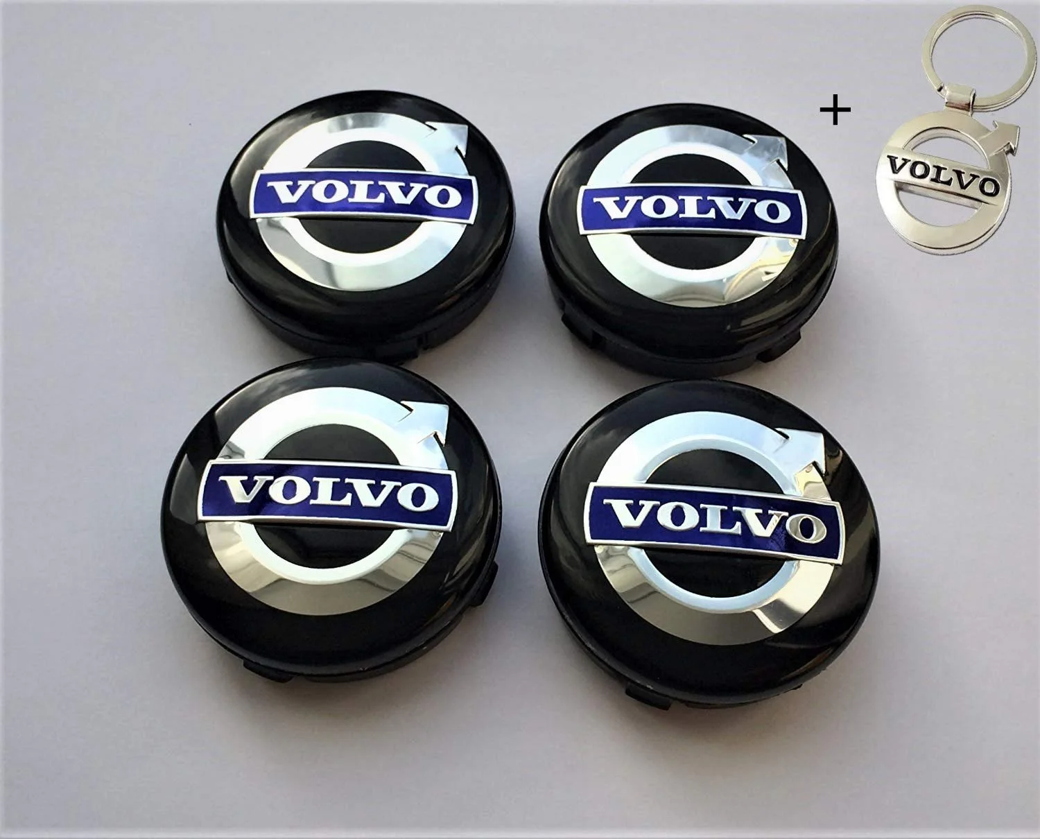 4 tapabujes gris con fondo negro para Volvo 64mm