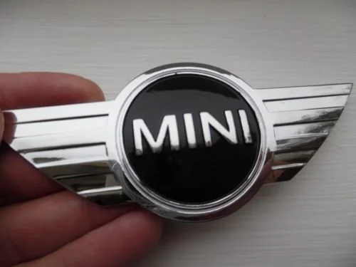 INSIGNIA LOGO MINI COOPER PARA CAPó O MALETERO, DE METAL, ADHESIVA.